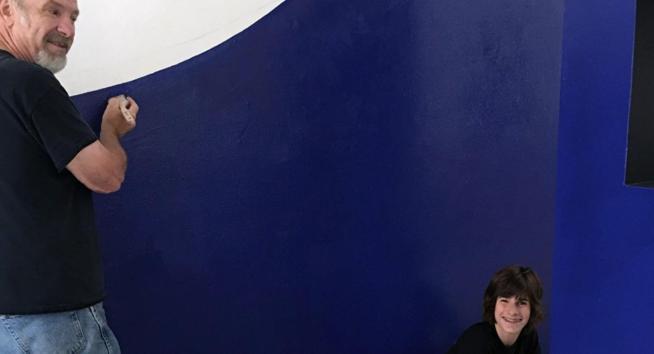alan and louis painting the wall in lapis blue