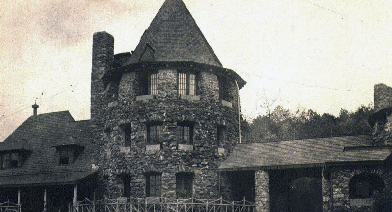 old picture of stone chataqua tower with pointed roof