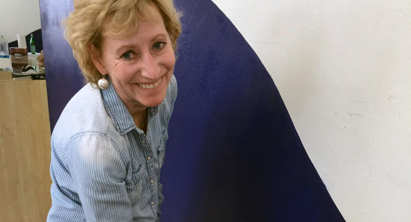 joan painting the wall blue