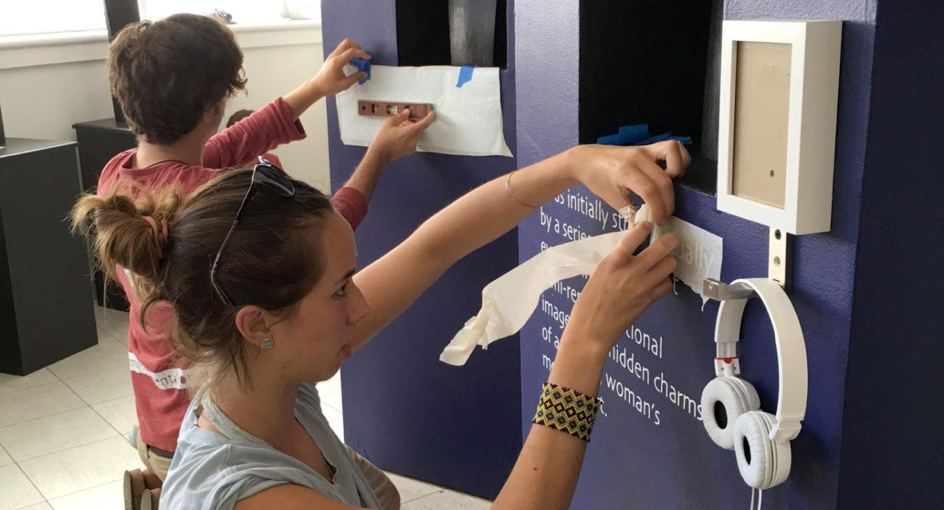 kaila and crispin putting up vinyl text