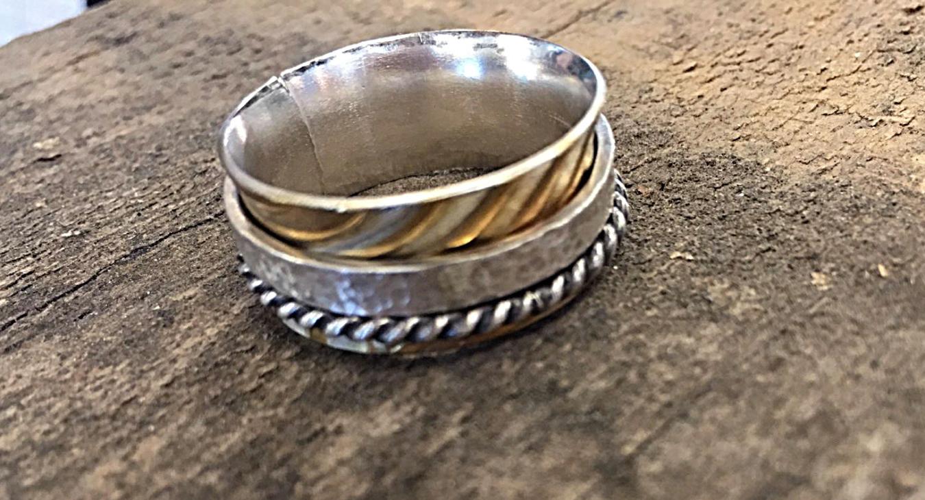 sterling spinner ring with textured and twisted bands