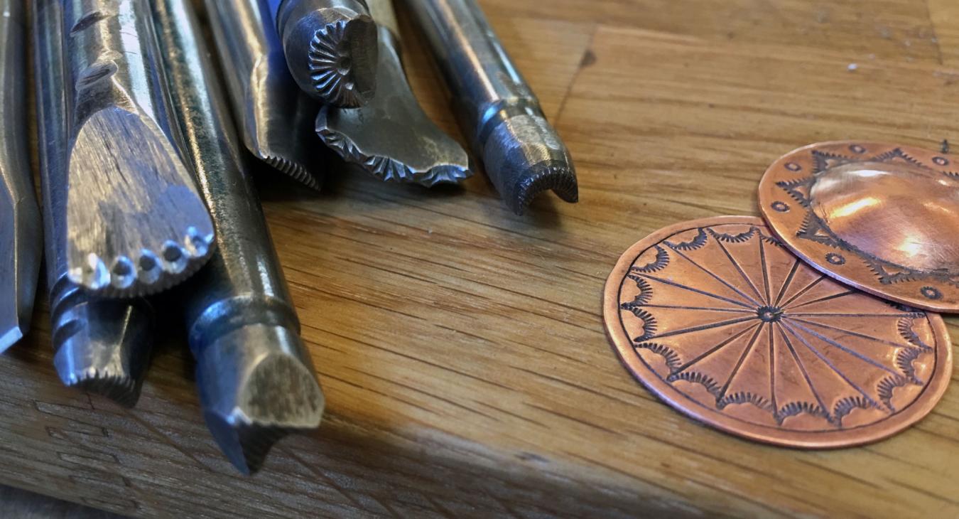 steel stamping tools next to copper samples