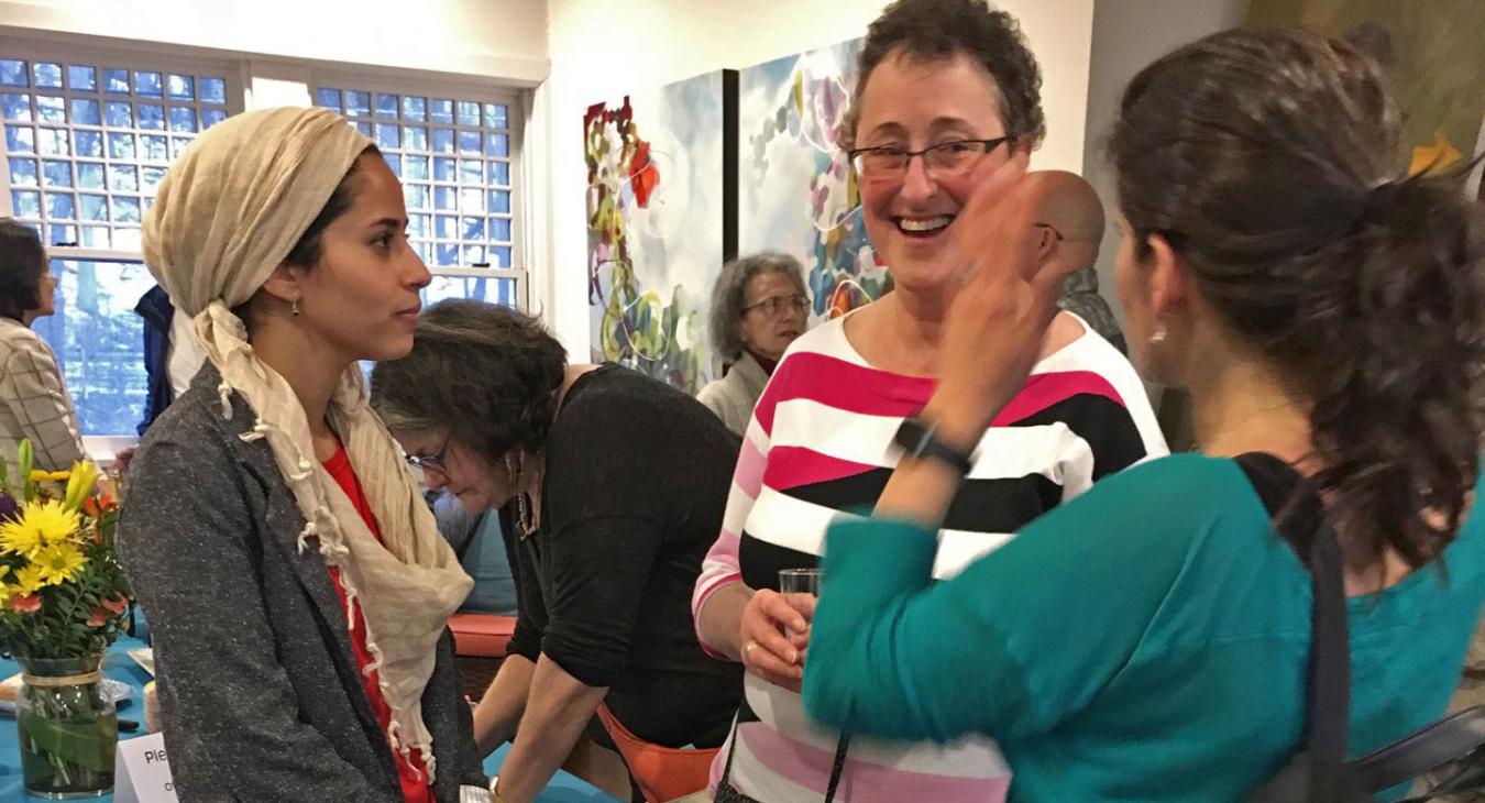 Mawadda chatting with people at the farewell party