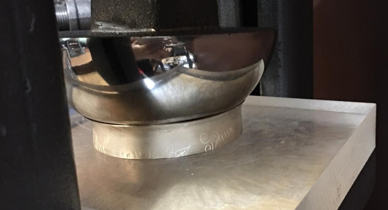 using hydraulic press on thick bangle to create flange on one side