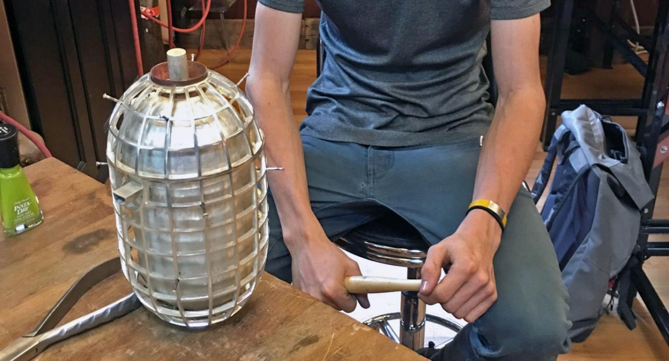 Louis looking at assembled but unfinished teapot