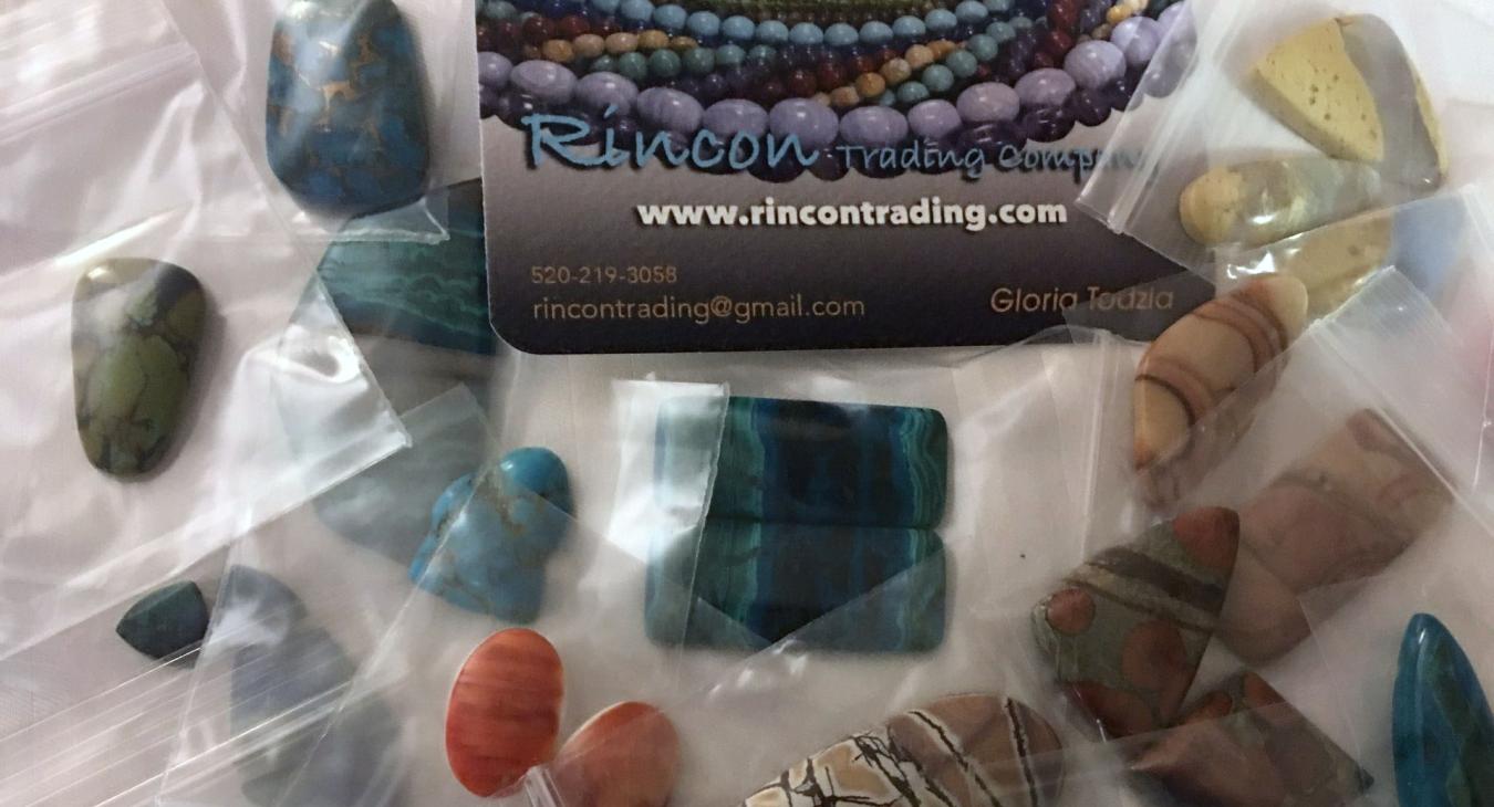 stones in packets next to company card