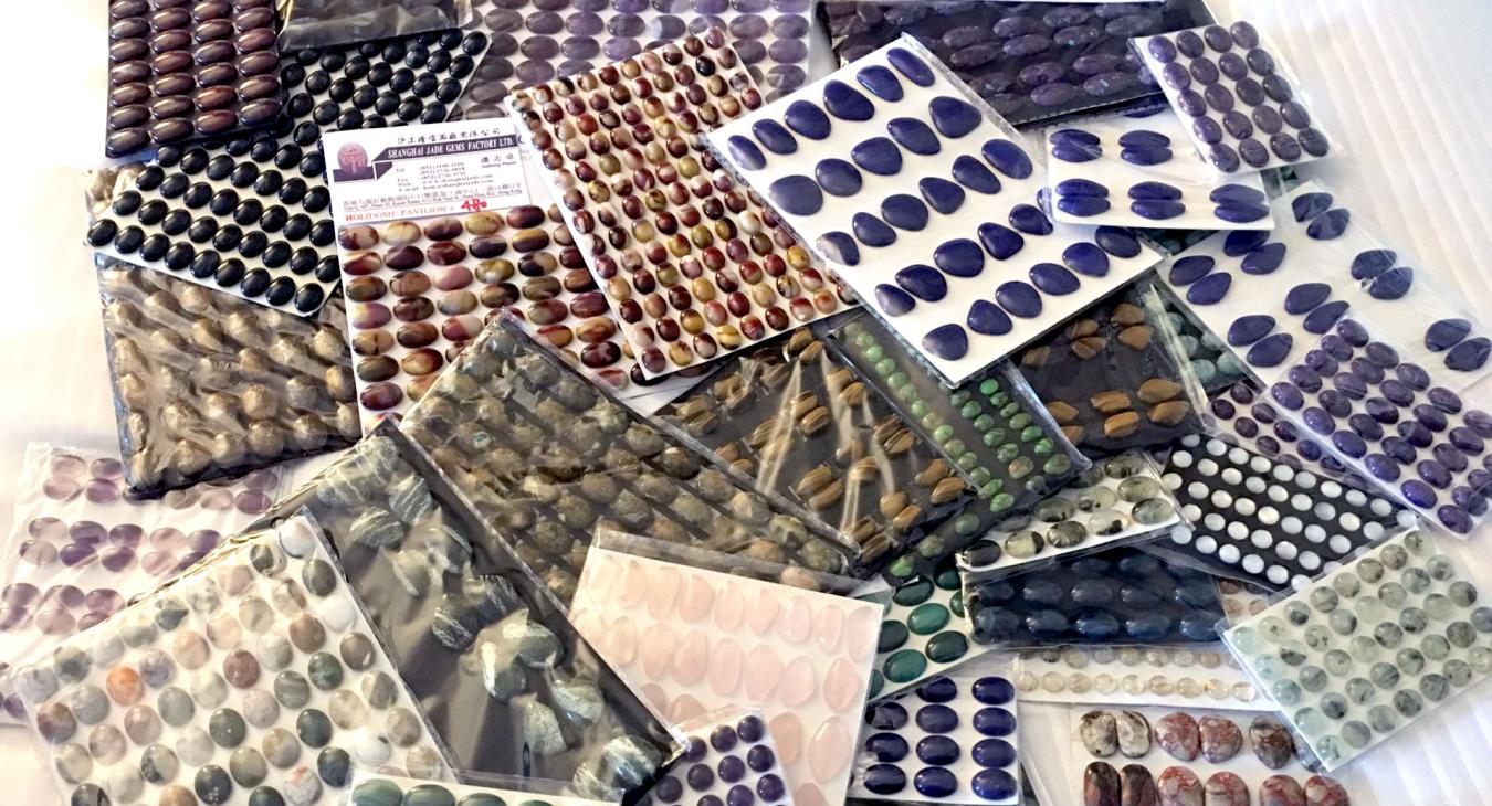 variety of cabochons on card backings 
