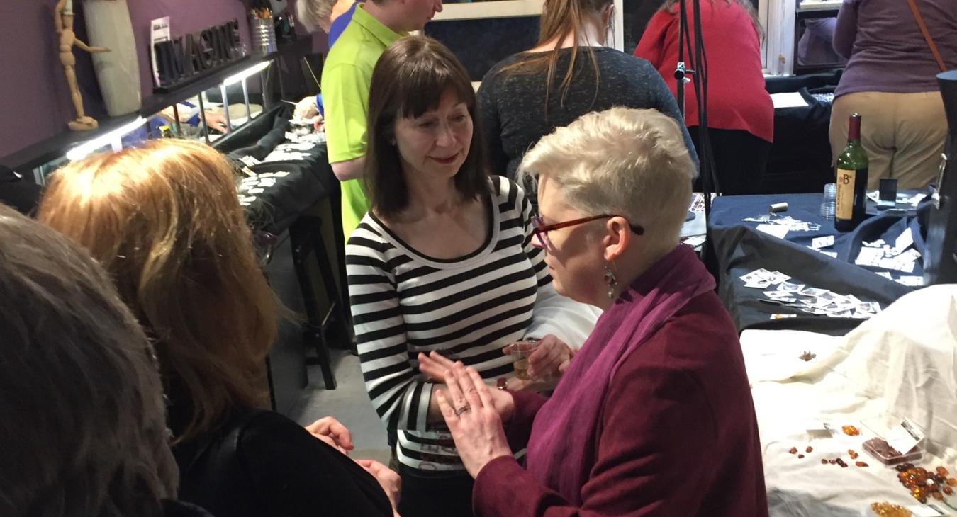 blair talking with gem show attendees in studio