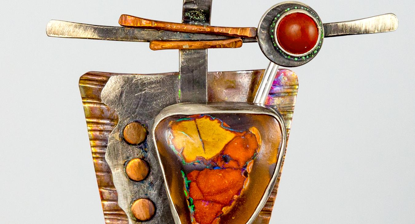 pendant with copper silver and orange and red stones