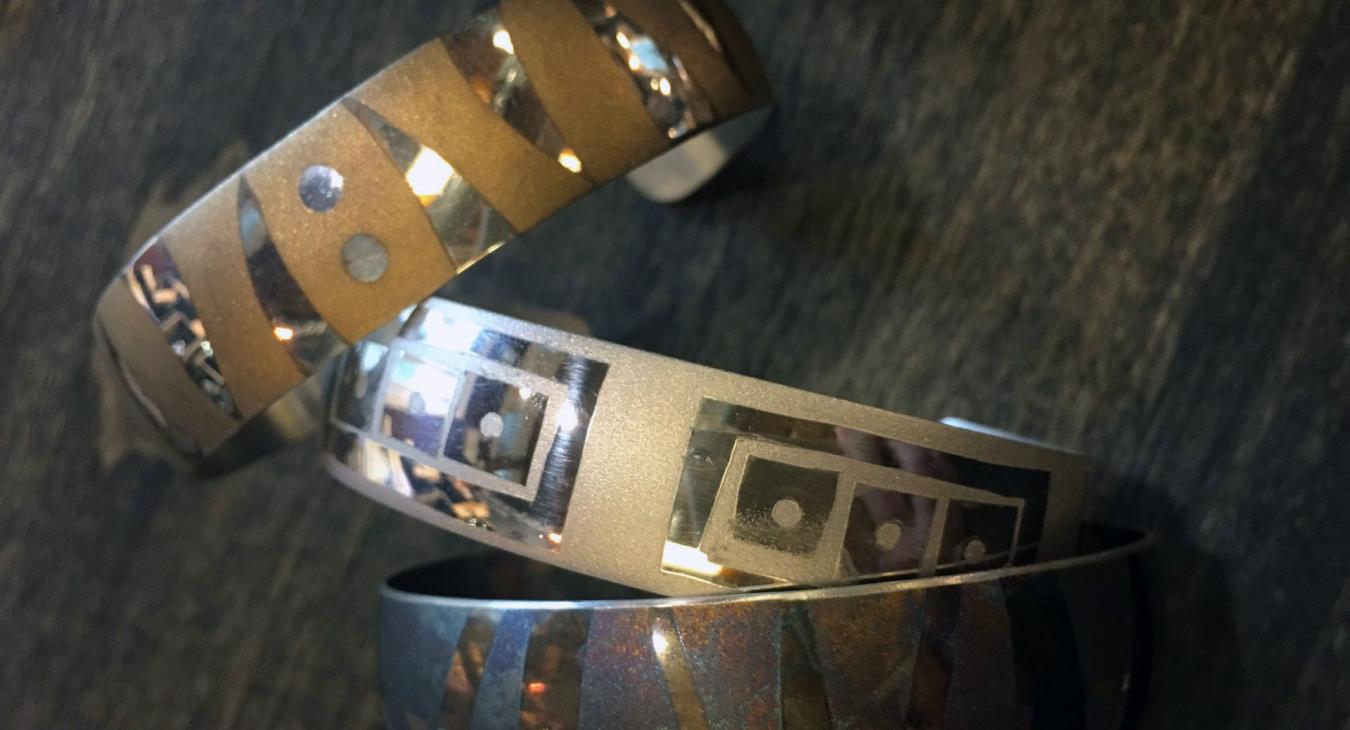 bracelet cuffs with sand blasted patterns and oxidized with liver of sulfur
