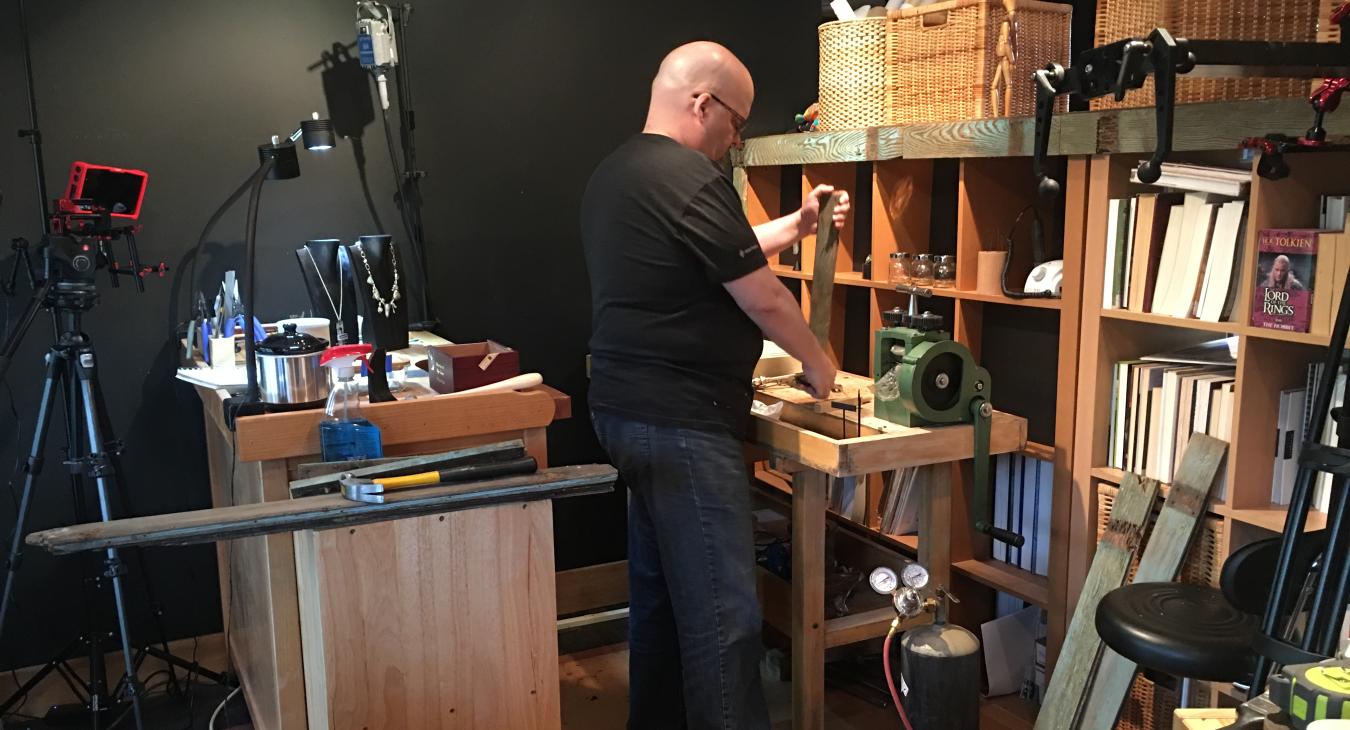 Bryan adding wood planks to studio setup for filming
