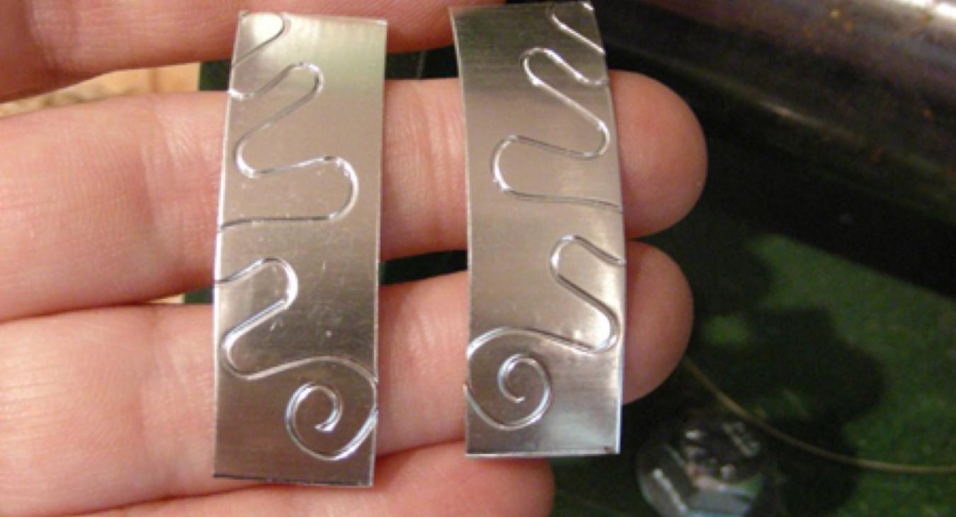 Silver with an embossed pattern