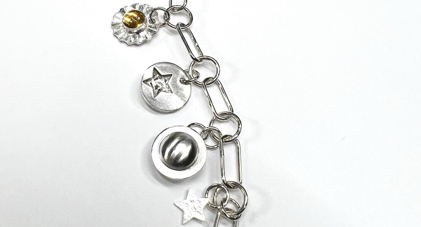 silver chain with star cut-out charms and citrine