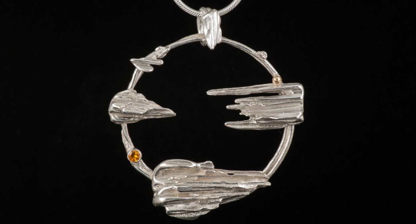 silver necklace with pointed silver cast pieces