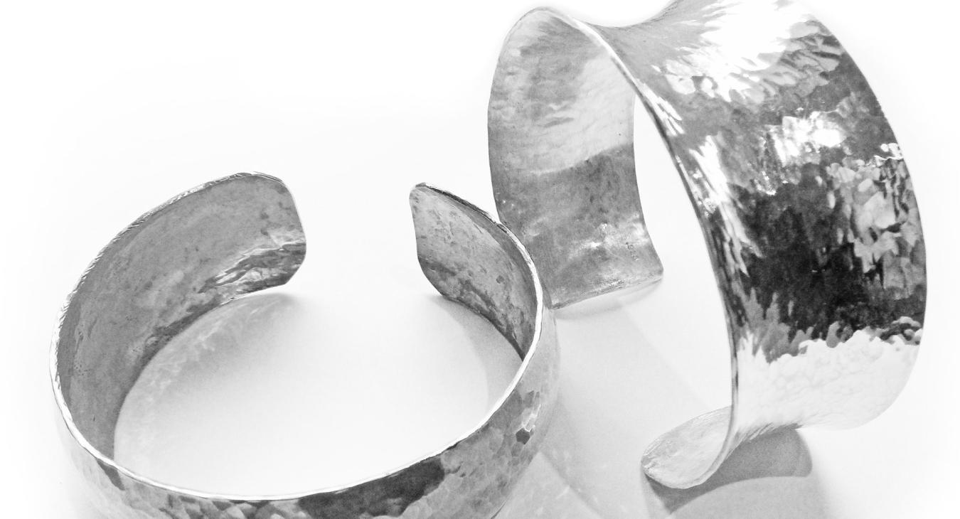 anticlastic and synclastic hammered silver cuffs