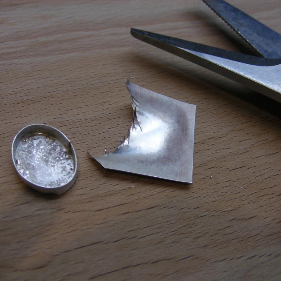 Trimming excess silver from bezel