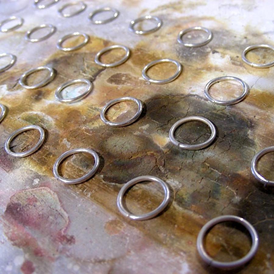 Silver rings on solder board ready to be soldered