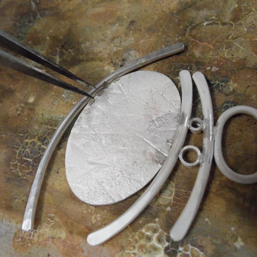 Pendant in process of being soldered