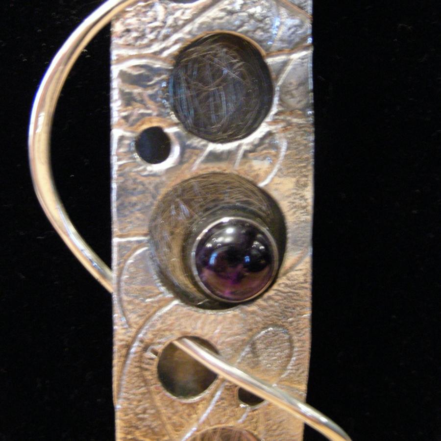 close up of amethyst on pendant