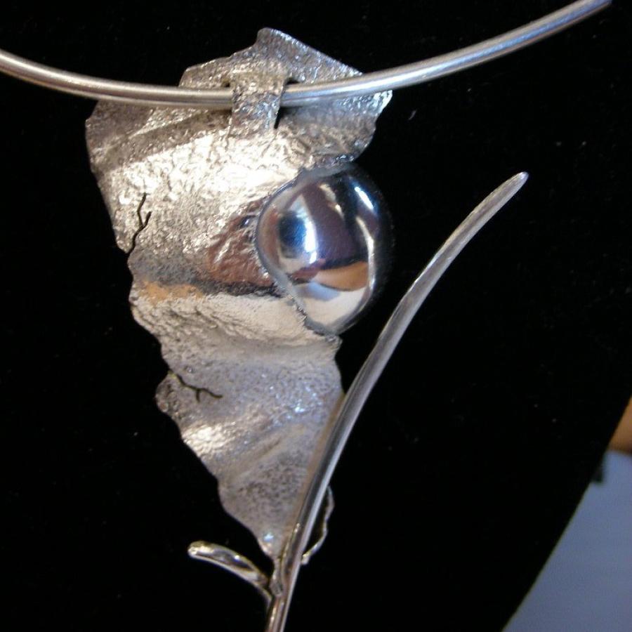 Reticulated silver and polished sphere pendant