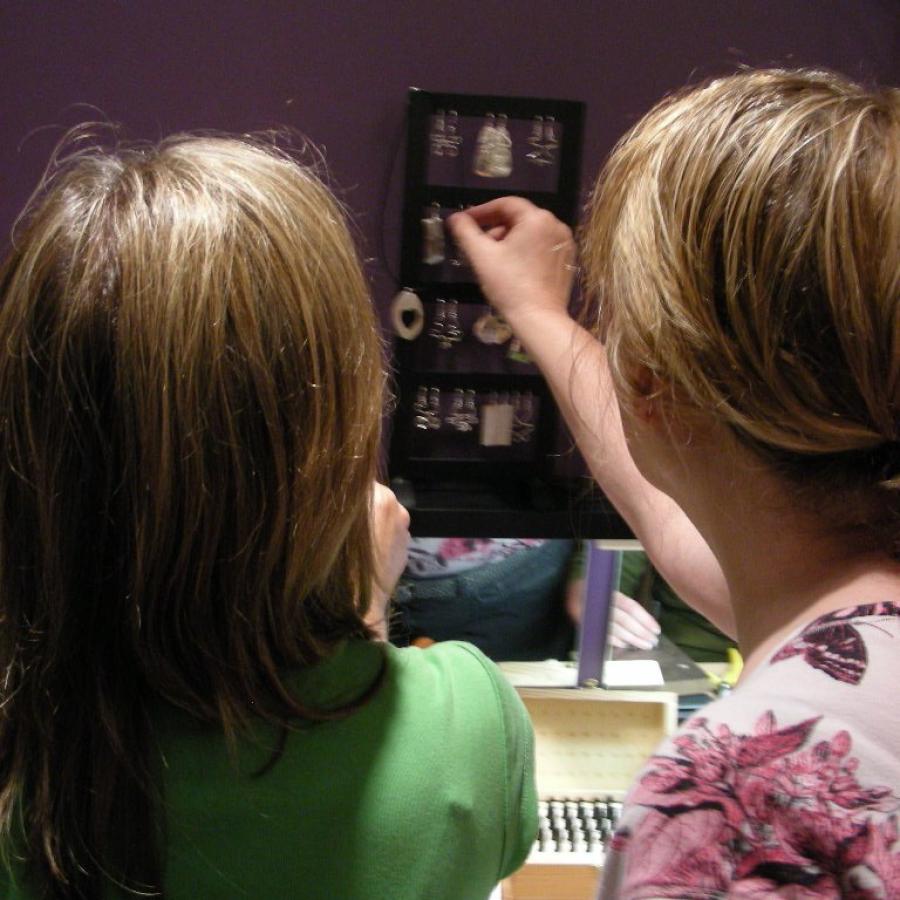 Student looking at silver earrings display