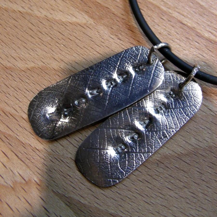 Letter pushed pendants by Roxana