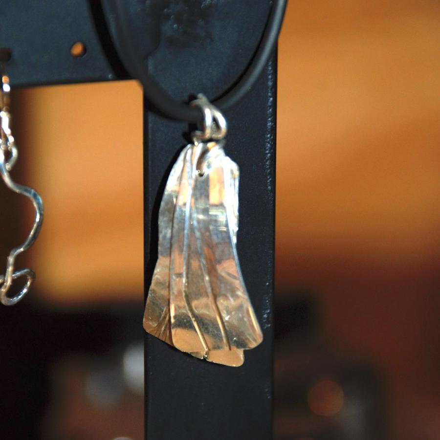 Two part flattened silver pendant by Sandy.