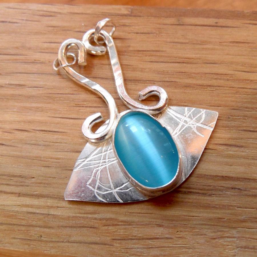 Silver pendant with blue set cabochon