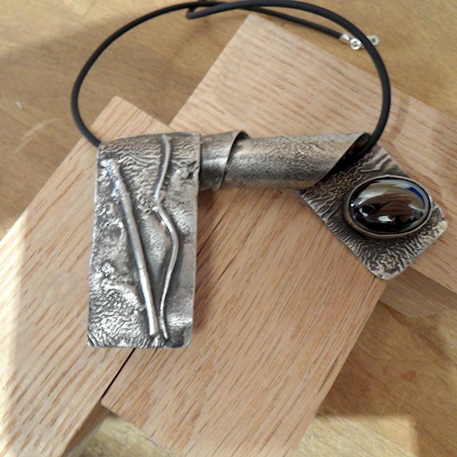 Folded reticulation silver pendant with brown stone
