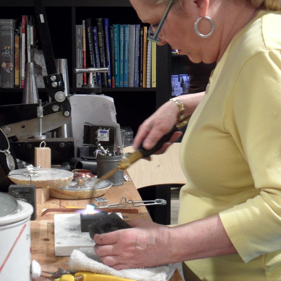 Getting ready to press the molten silver