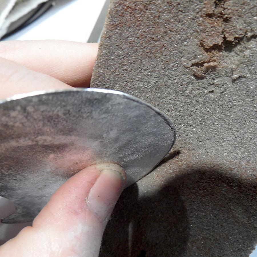 Reticulated backing is being sanded