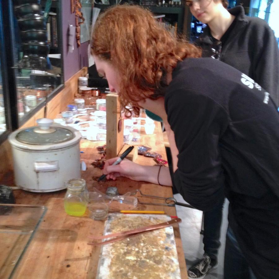 Tessa tagging her burn mark on bench