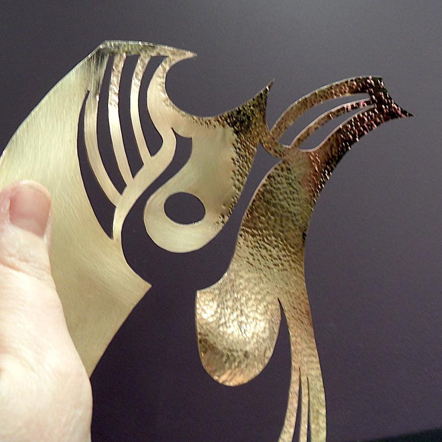 Brass piece with partial hammer texture