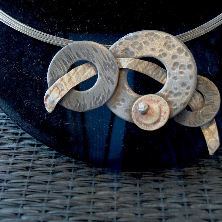 "Orbits" by Judy Madden with red "sold" sticker