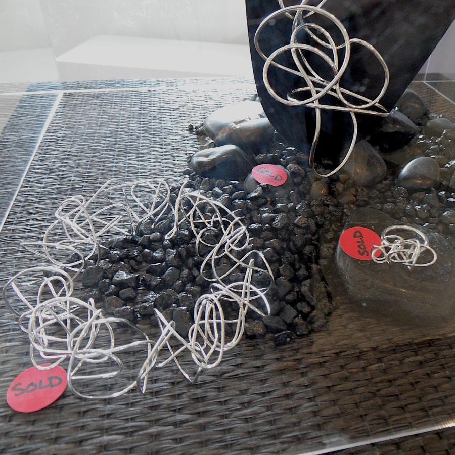 Pieces with red "sold" stickers