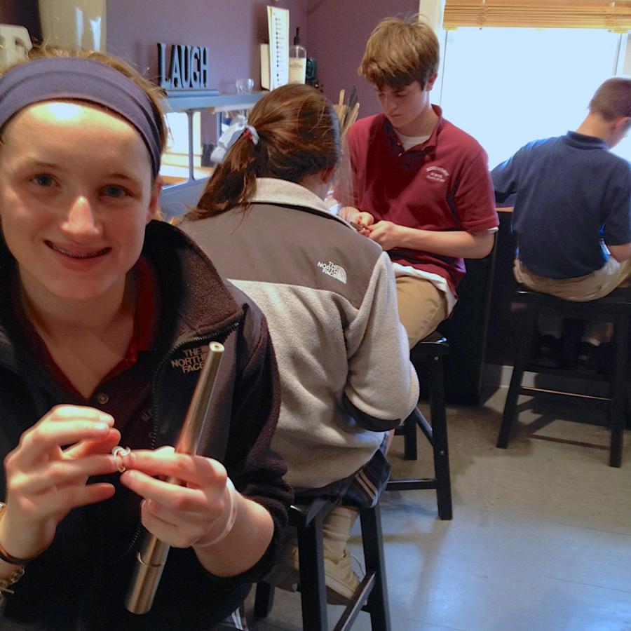 Here Emma finishes her wire ring. Behind her is Caroline, Sean, and Ben.