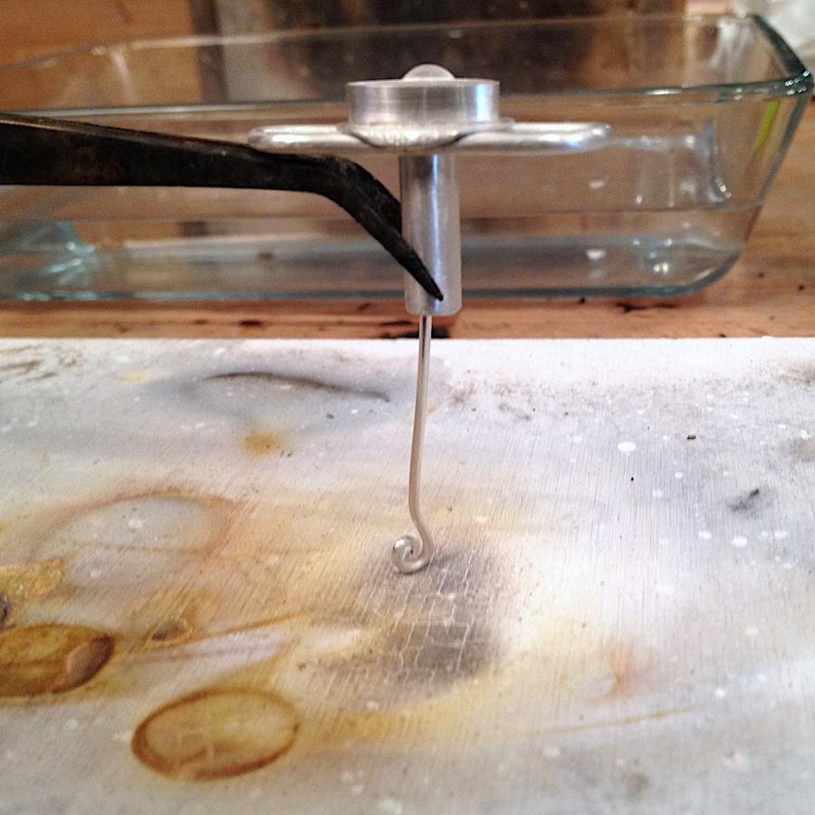 Staging pieces of the pendant on solder board