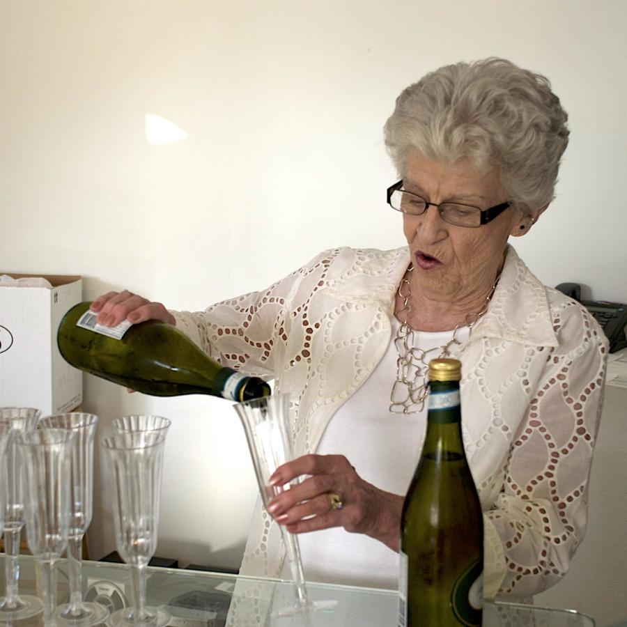 My mom Jan Callihan pouring champagne