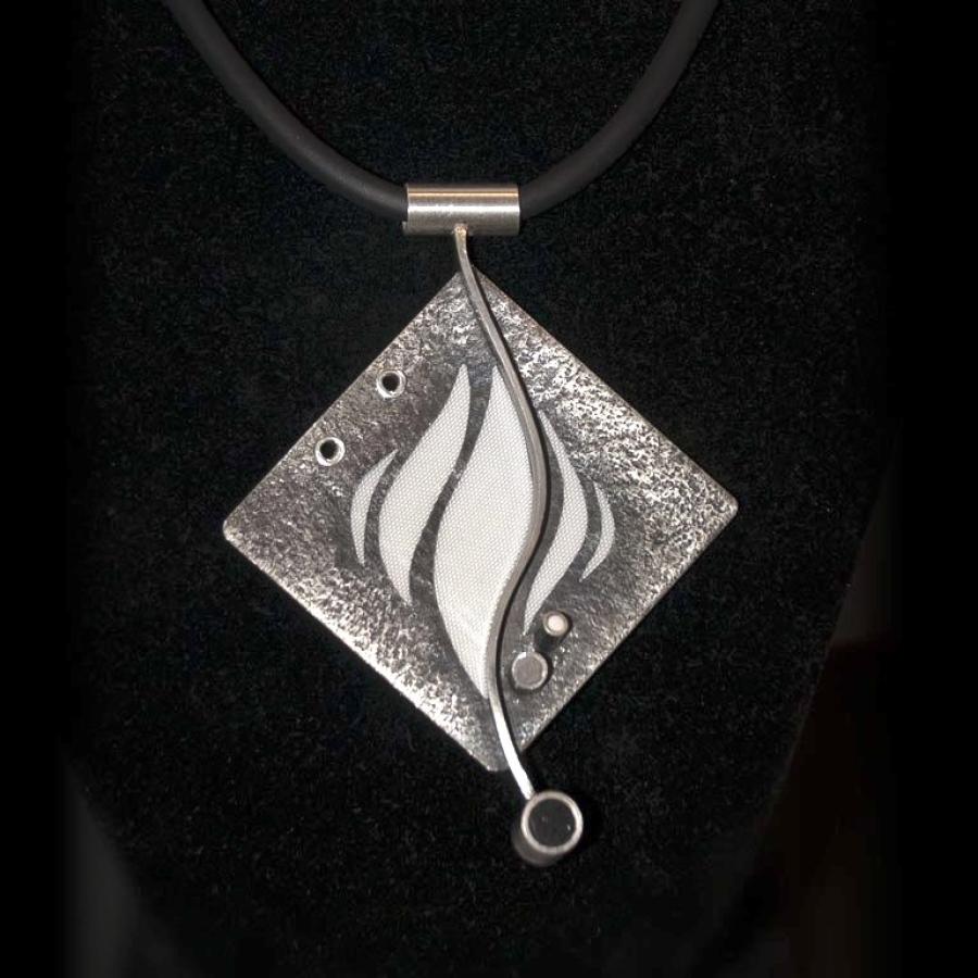 Textured diamond shaped silver pendant with white flames