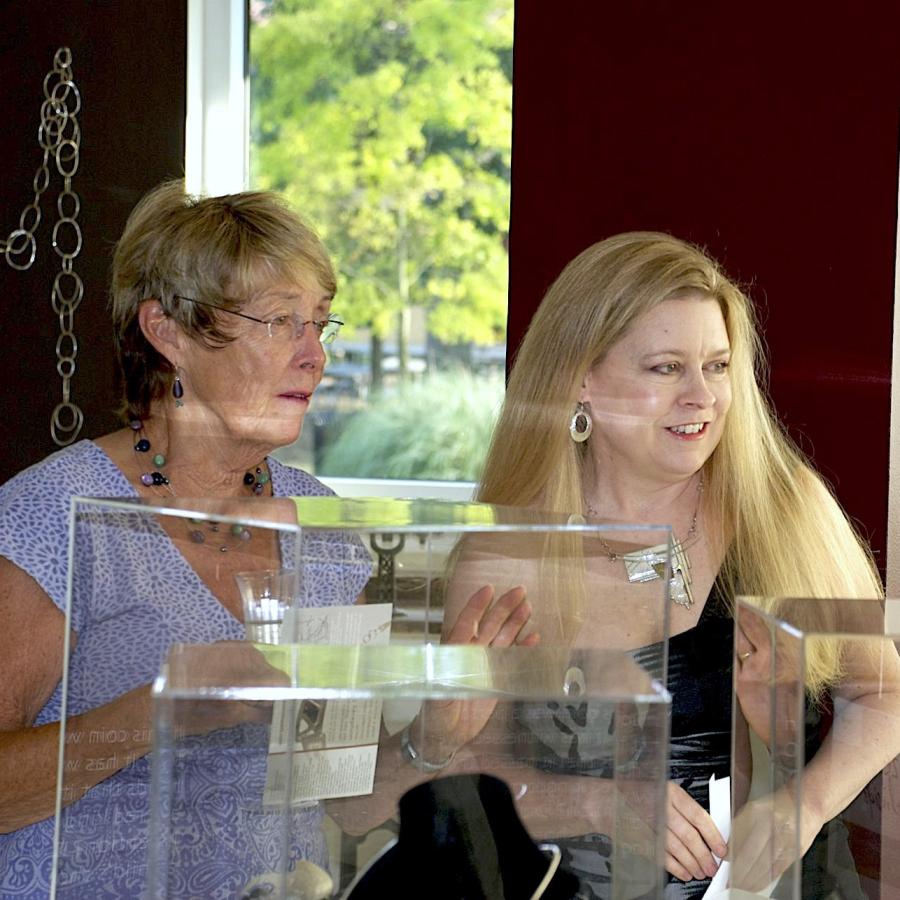 Blair and her moth next to display cases