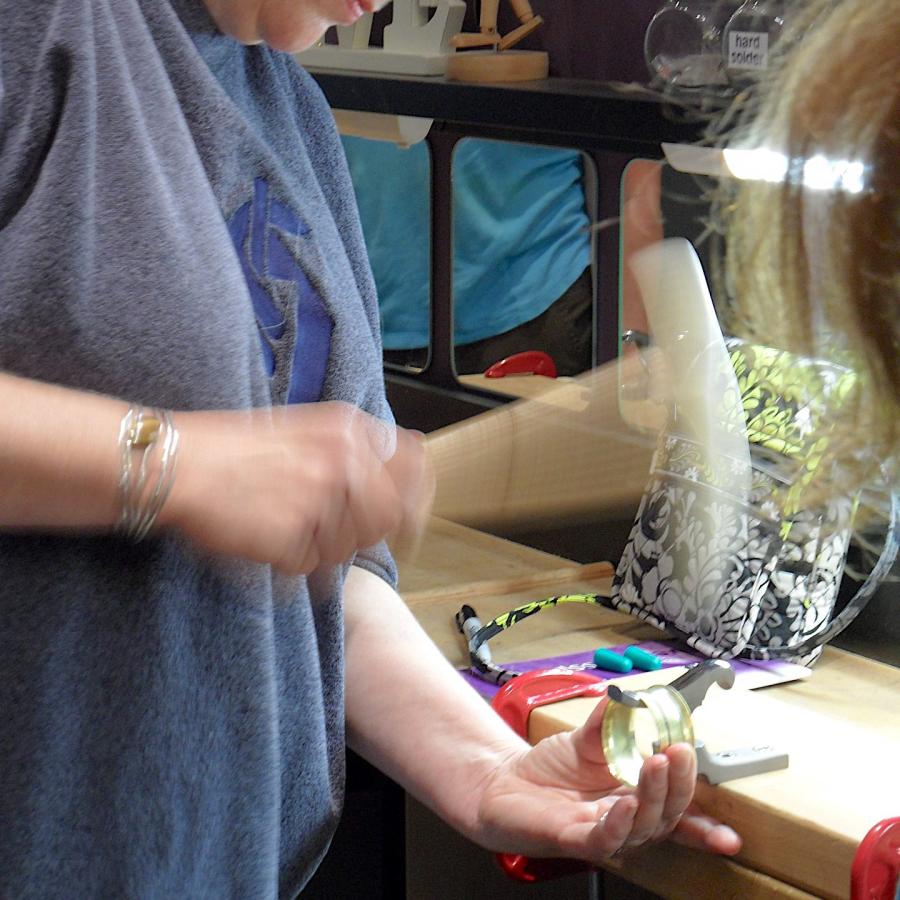 Motion blurred hammering from Cathy hammer forming the bracelet.