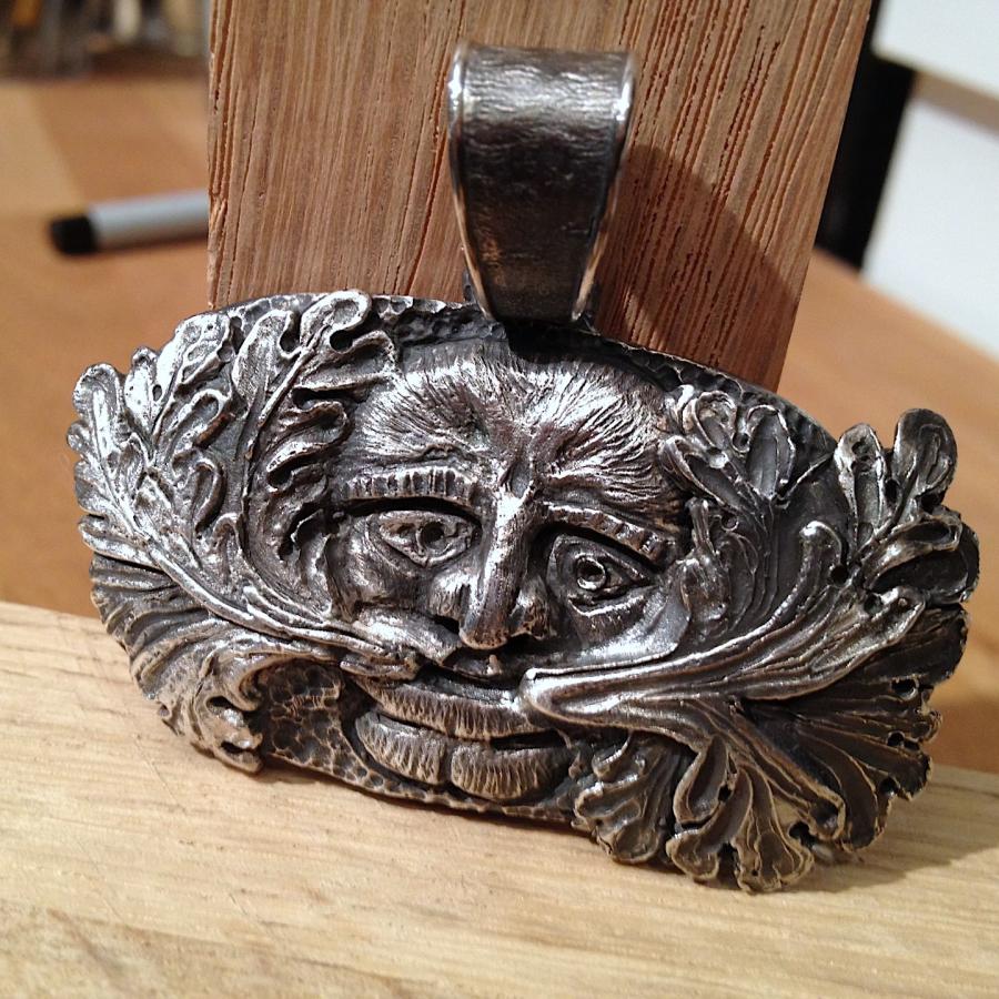 Finished cast face pendant