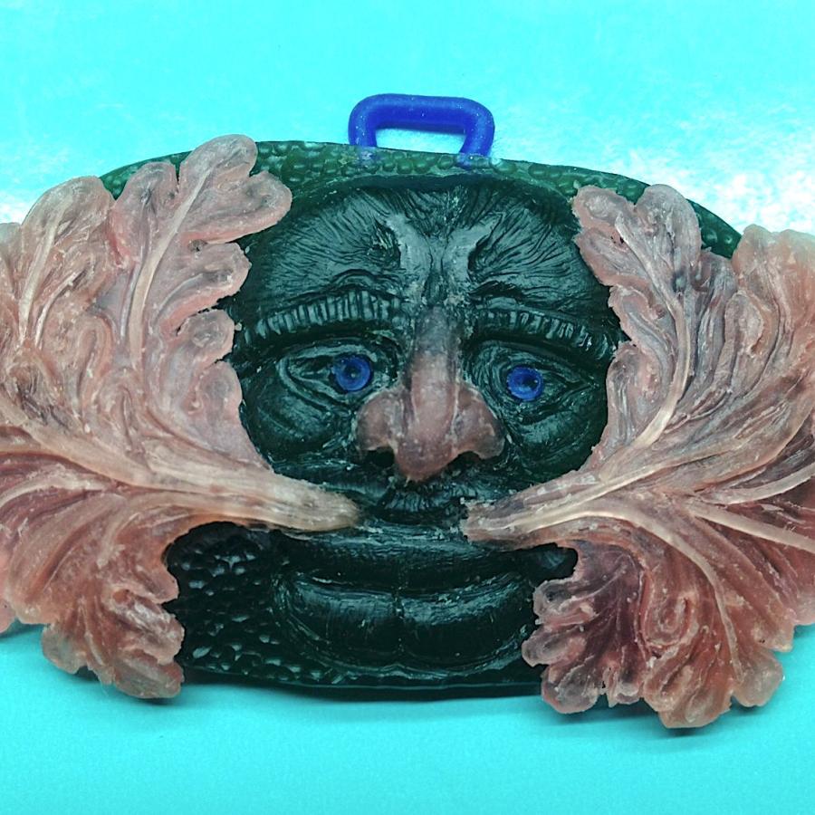 Wax model of face pendant