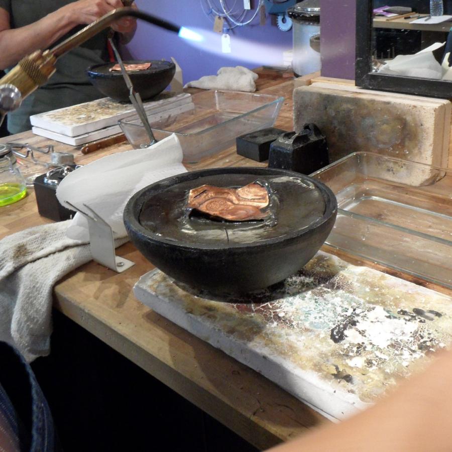 A copper panel in pitch