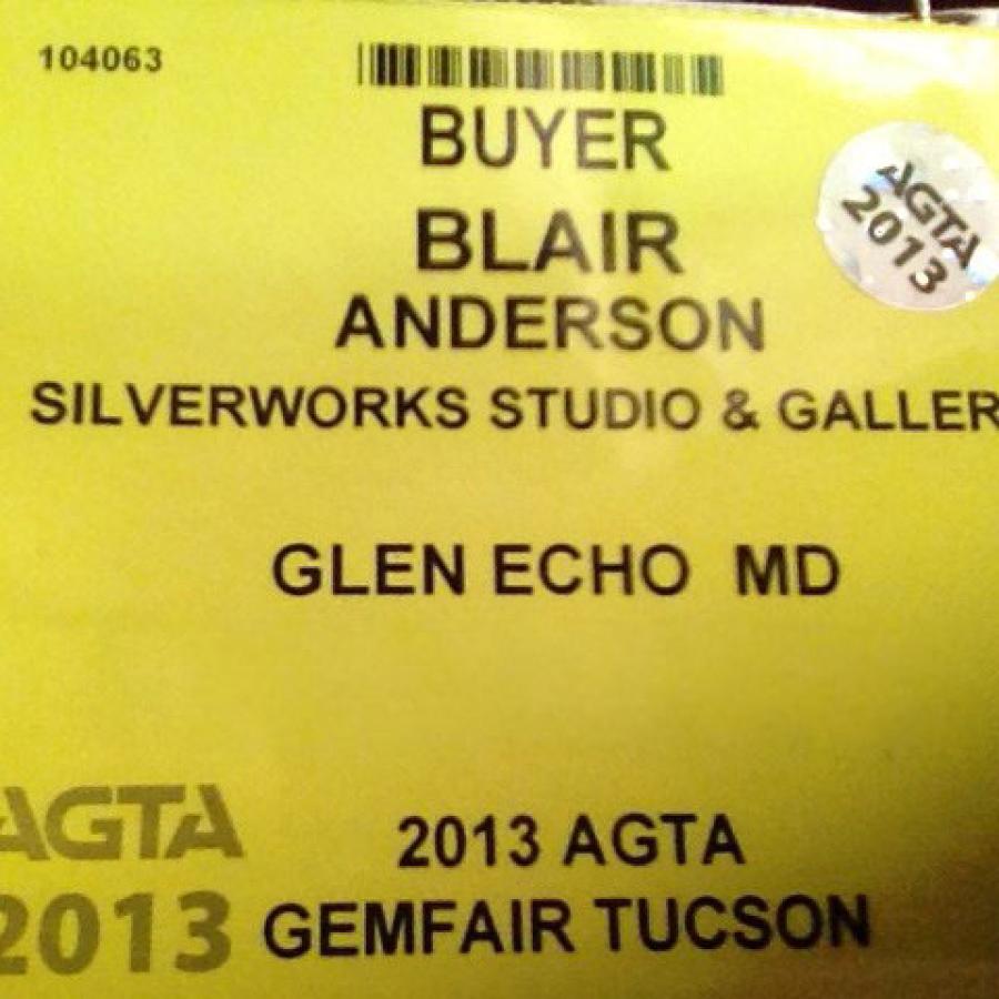 Blair's yellow AGTA badge
