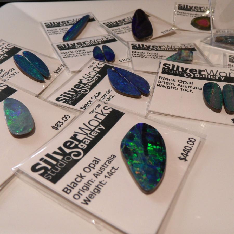 opals and other gemstones in silverworks packets