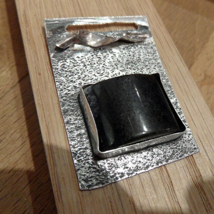 square textured pendant with black stone 