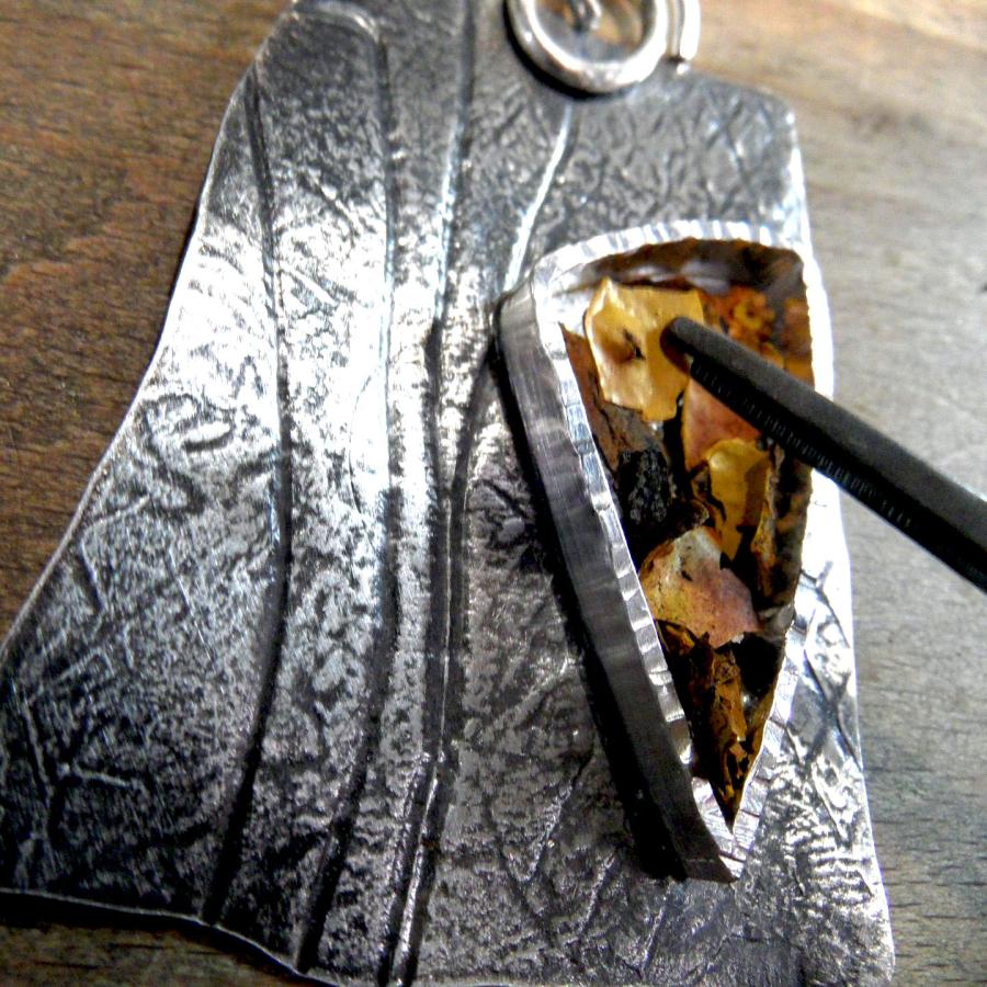 Bulldozer rust flakes set in resin