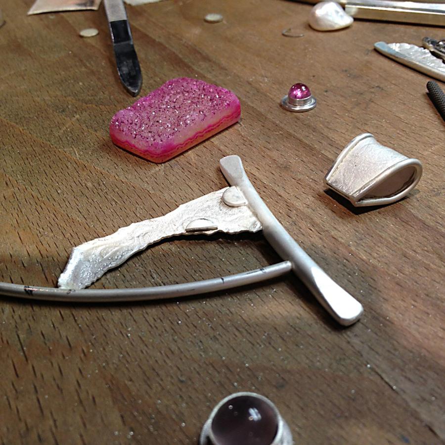 pieces of pendant on bench