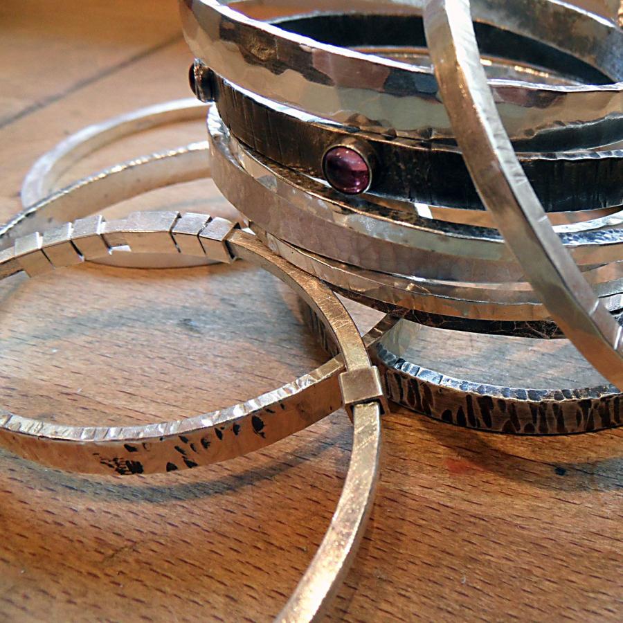 Silver bangles stacked up